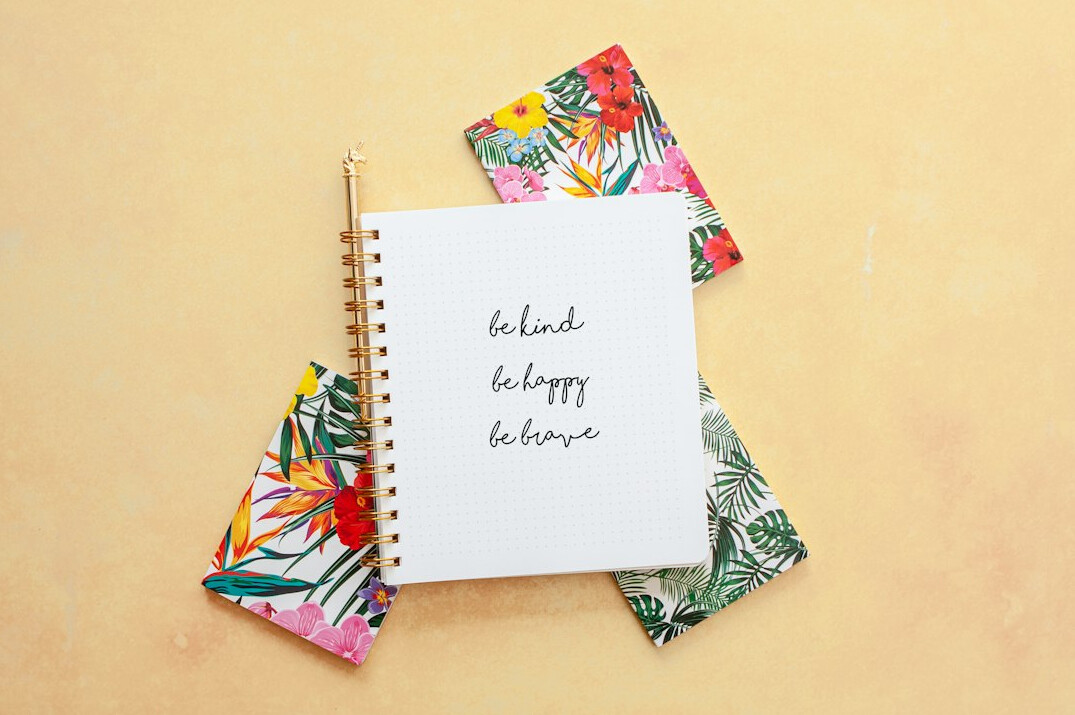 Notebook with handwritten notes and a pen