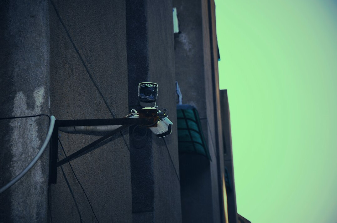 store detective watching security camera