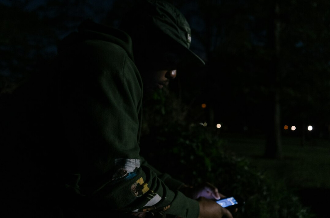 detective writing notes at night